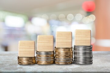 Set of wooden cubes or blocks on coins