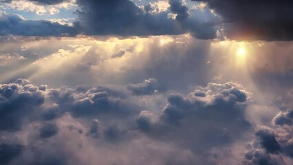 Wall Mural - an aerial shot above beautiful cloudscape with sun rays coming through the clouds, detailed pictures