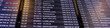 © Gray wall studio - Scoreboard in international airport, info screen with names flights and cities