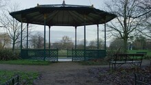 Camera Reveals An Empty Bandstand In A Park On A Grey And Cold Morning