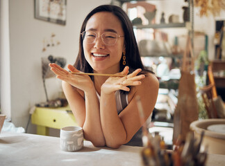 Poster - Portrait, pottery and art with an asian woman in her studio or workshop for design and creative hobby. Happy, smile or designer with a female artist working in her small business startup for ceramics