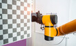 © xiaoliangge - Robotic artificial automated manufacturing smart robot holding mobile phone