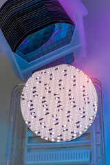 Sticker - patterned silicon wafers in a universal pod. Electronic circuit designs have been built onto the wafers using micromaching including photolithography