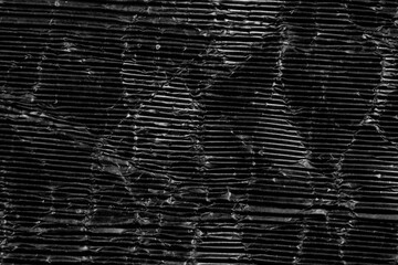 Wall Mural - Crumpled wrinkled black paper. Corrugated aged grunge cardboard surface