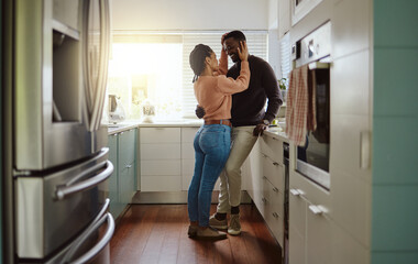 Canvas Print - Black couple, love and bonding in the kitchen at home with care and happiness in a marriage with commitment. Young man and woman together with a romantic hug while in their house or apartment