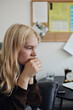 © Maskot - Thoughtful depressed blond teenage girl sitting in school office