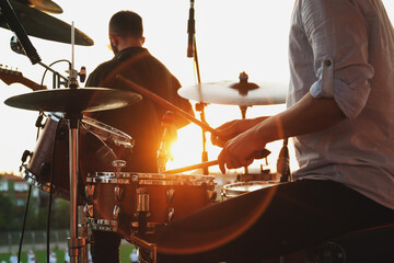 Close up shot of drum set and drummer on a concert.