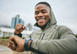 © S Fanti/peopleimages.com - Fitness, goal and black man reading watch for training progress, running celebration and exercise success in Nigeria. Monitor, celebrate and runner happy with cardio performance on smart watch