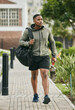 © S Fanti/peopleimages.com - Fitness, travel or black man walking to gym for body training, exercise or workout with water bottle or gym bag in Atlanta. Path, mindset or healthy sports athlete with wellness goals or motivation