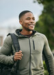 © S Fanti/peopleimages.com - Fitness, travel or happy black man walking to gym for training, exercise or workout with duffle bag in Atlanta. Pride, mindset or healthy sports athlete smiles with body goals, motivation or mission