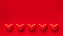 Valentine's Day Banner With Five Red Hearts On A Red Background With Space For Text. Love And Happiness.