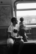 Father And Son Riding Subway