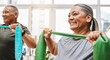 © C Davids/peopleimages.com - Physiotherapy, stretching band and senior couple with teamwork for muscle wellness, rehabilitation and support together. Elderly black people or friends smile in physical therapy with strong progress