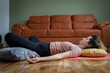 © Miljan Živković - One adult caucasian woman practice restorative yoga at home