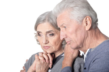 Wall Mural - Portrait of sad old nice couple isolated on white background