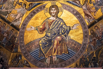 Wall Mural - Golden religious mosaic of Jesus decorating wall inside catholic church in Florence