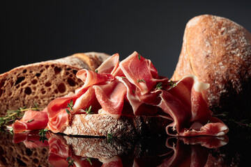 Wall Mural - Prosciutto with bread and thyme.