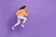 © deagreez - Full size profile portrait of excited crazy person jumping running empty space isolated on purple color background