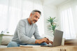 © eggeeggjiew - Confident Bearded mature adult man using and typing on laptop, Working at home office, Remote working, freelancer