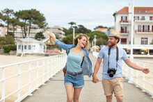 romantic couple walking on the pier