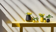 © ADDICTIVE STOCK - Generative AI of potted plants on yellow table