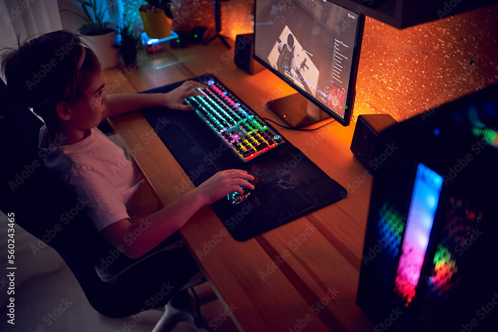 Image of immersed teenage gamer boy playing video games on computer in ...