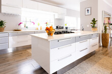 General View Of Luxury Kitchen With White Countertops And Cupboards