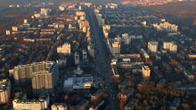 Aerial Drone View Of Chisinau At Sunset, Moldova. View Of The City, Residential District With Buildings, Roads And Parks With Bare Trees