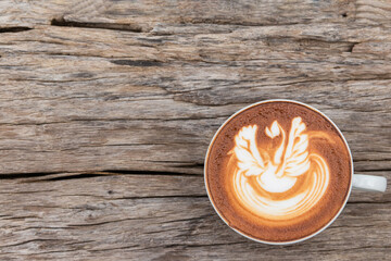 Top view mocha of coffee with chocolate on a wooden table background.