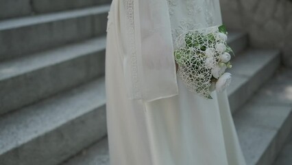 Wall Mural - wedding rings on a bouquet