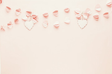 Wall Mural - Colorful paper garland of hearts on the living coral background. Valentine day greeting cards.