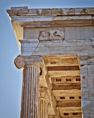 Wall Mural - Detail of the capital of Ionic style column and ceiling of the ancient small Temple of Athena Nike on the Acropolis. Cultural trip to Athens, Greece.