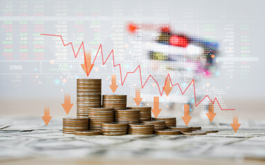 The Inflation and recession of the economy of global.The concept of economic collapse and the collapse of the stock exchange on stacks of coins and a graph arrow pointing down.