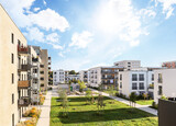 Fototapeta Londyn - Cityscape of a residential area with modern apartment buildings, new green sustainable urban landscape in the city