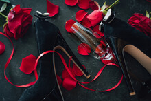 Romantic Valentines Day Rendezvous With Red Roses And Black Stilettos. Background For Love And Special Moments. Top View.