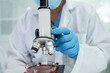 © amazing studio - Asian scientist biochemist or microbiologist working research with a microscope in laboratory. For protect outbreak Coronavirus Covid19, bacteria and germs.