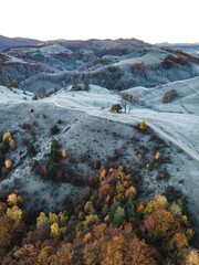 Poster - Autumn landscape with frosty mountains at sunrise. Aerial view from drone. Dumesti,Alba,Romania.