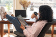© ADDICTIVE STOCK - Woman resting with tablet in home office