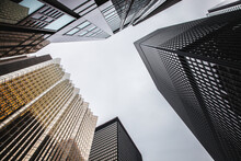 A Low-angle Shot Of Several Distinct Skyscraper Facades In Toronto