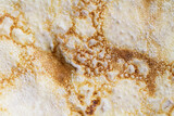 Fototapeta Storczyk - Pancake surface texture and pattern. Close-up of thin hot pancakes in a plate. Traditional rustic food. Graphic resource.