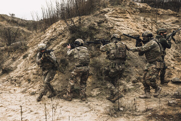 Wall Mural - Soldiers on a shooting range looking concentrated and attentive