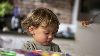 Toddler boy refusing food. Baby two year old not wanting to eat