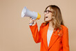 © ViDi Studio - Young employee business woman corporate lawyer wear classic formal orange suit glasses work in office hold scream aside megaphone announces discounts sale Hurry up isolated on plain beige background.