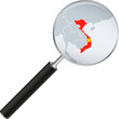 Vietnam map with flag in magnifying glass.