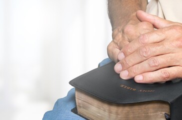 Canvas Print - Christian person praying with Holy bible book