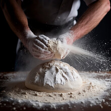 Men's Hands Knead Dough On A Floured Table, Close-up