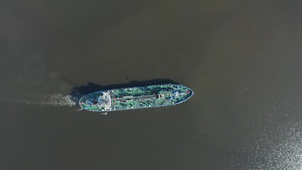 Poster - Aerial top view general small ship tugboat with tanker fuel floats in the bay of the port