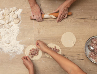 Poster - Cooking dough with meat on the table.