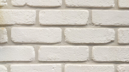 Wall Mural - white stone beige wall of facade brick horizontal grunge background