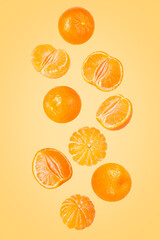 Poster - Falling peeled sliced tangerine isolated on white